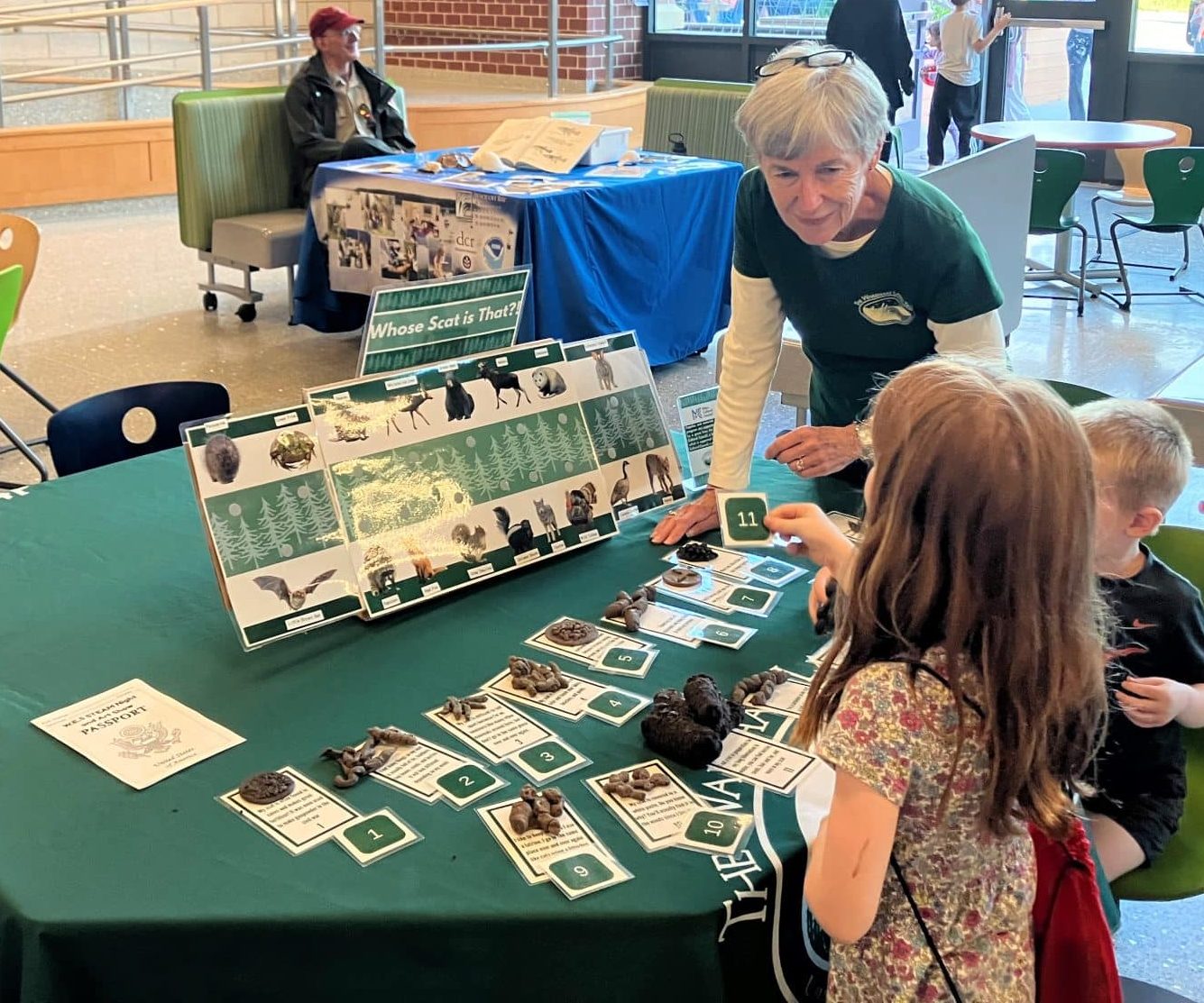 Educator interacts with children to play matching scat game
