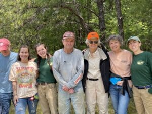 Members of WLT standing in forest