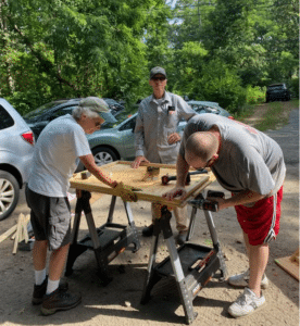 A group of people building a table
